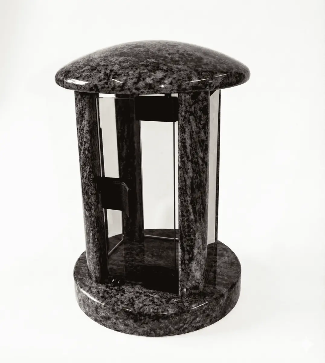 Tall round dark granite memorial lantern with a domed lid and clear glass panels.