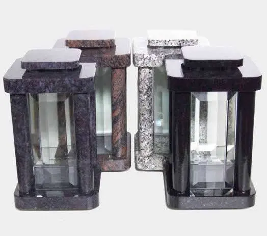 Set of square granite memorial lanterns in black, grey, white and brown finishes with clear glass panels.