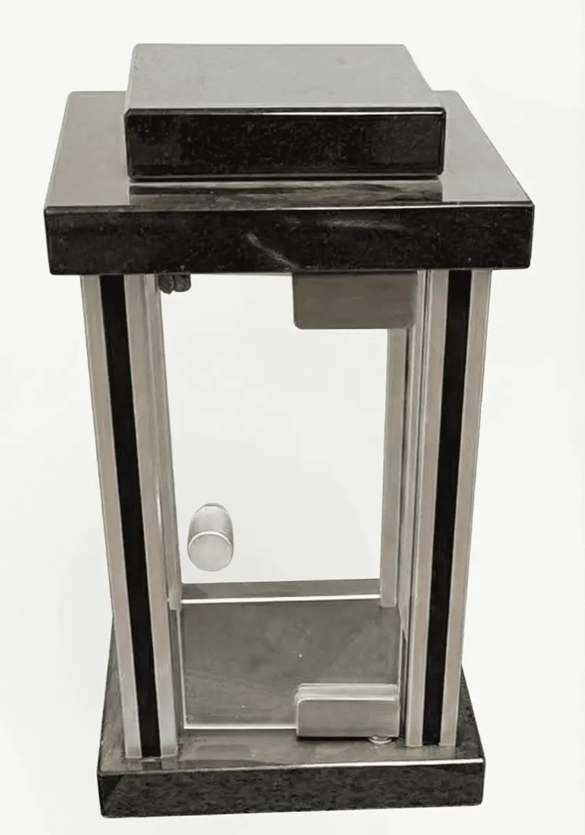 Rectangular black granite memorial lantern with brushed metal trims and front-opening glass door.